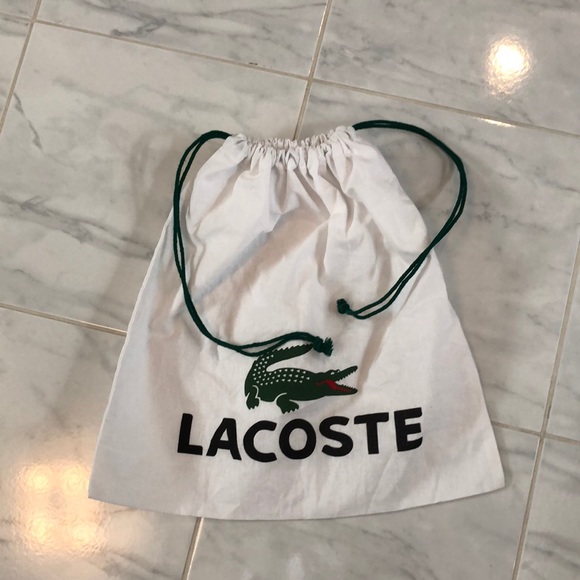 Lacoste Handbags - Lacoste white drawstring bag / shoe dust cover. EUC!